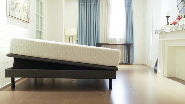 Ergomotion Ascend adjustable bed with a mattress, head end tilted up - Bedplanet