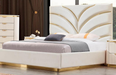 McFerran B1001 bed with creamy white bonded leather headboard, fanned gold channel detail and gold-tone base