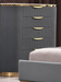 McFerran B1003 five-drawer chest, gray fluted front with gold-tone top band and plinth base