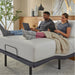 Couple working on laptops on a mattress raised by the baselogic Pearl Adjustable Base