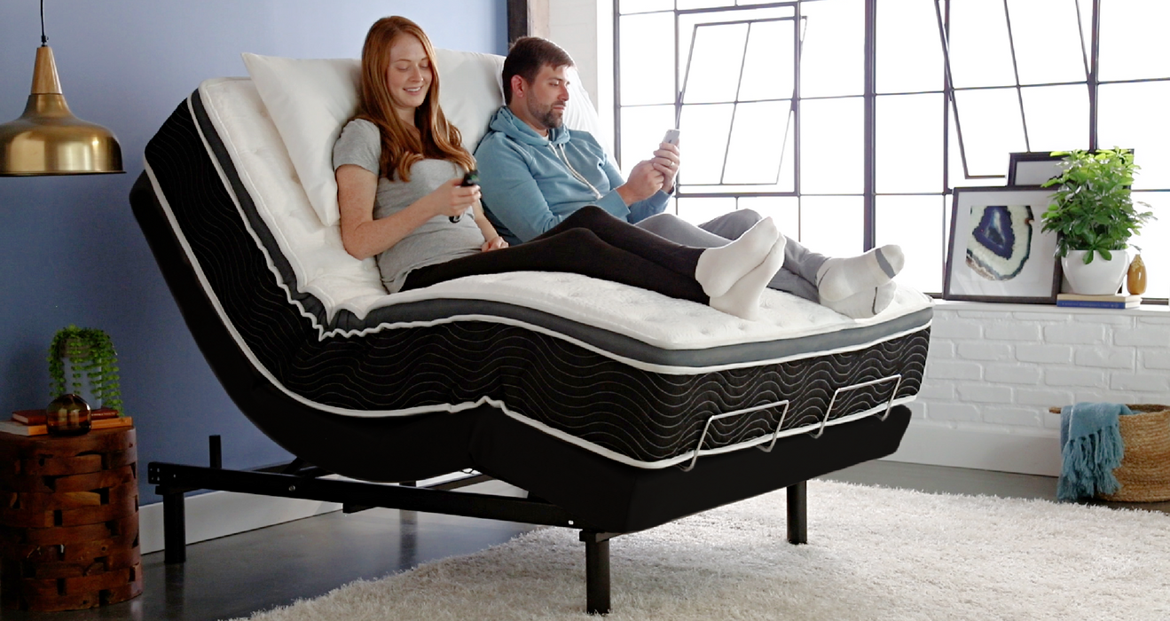 Couple relaxing on the Ergo-Pedic iTilt Adjustable Bed - Bedplanet