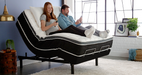 Couple relaxing on the Ergo-Pedic iTilt Adjustable Bed - Bedplanet