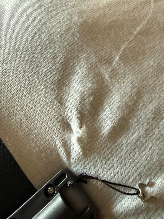 Open box Ergo-Pedic iTilt adjustable bed close-up of cosmetic fabric snag on sleep deck - Bedplanet