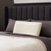 Malouf Zoned Talalay Latex Pillow latex core on a bed, three-quarter view