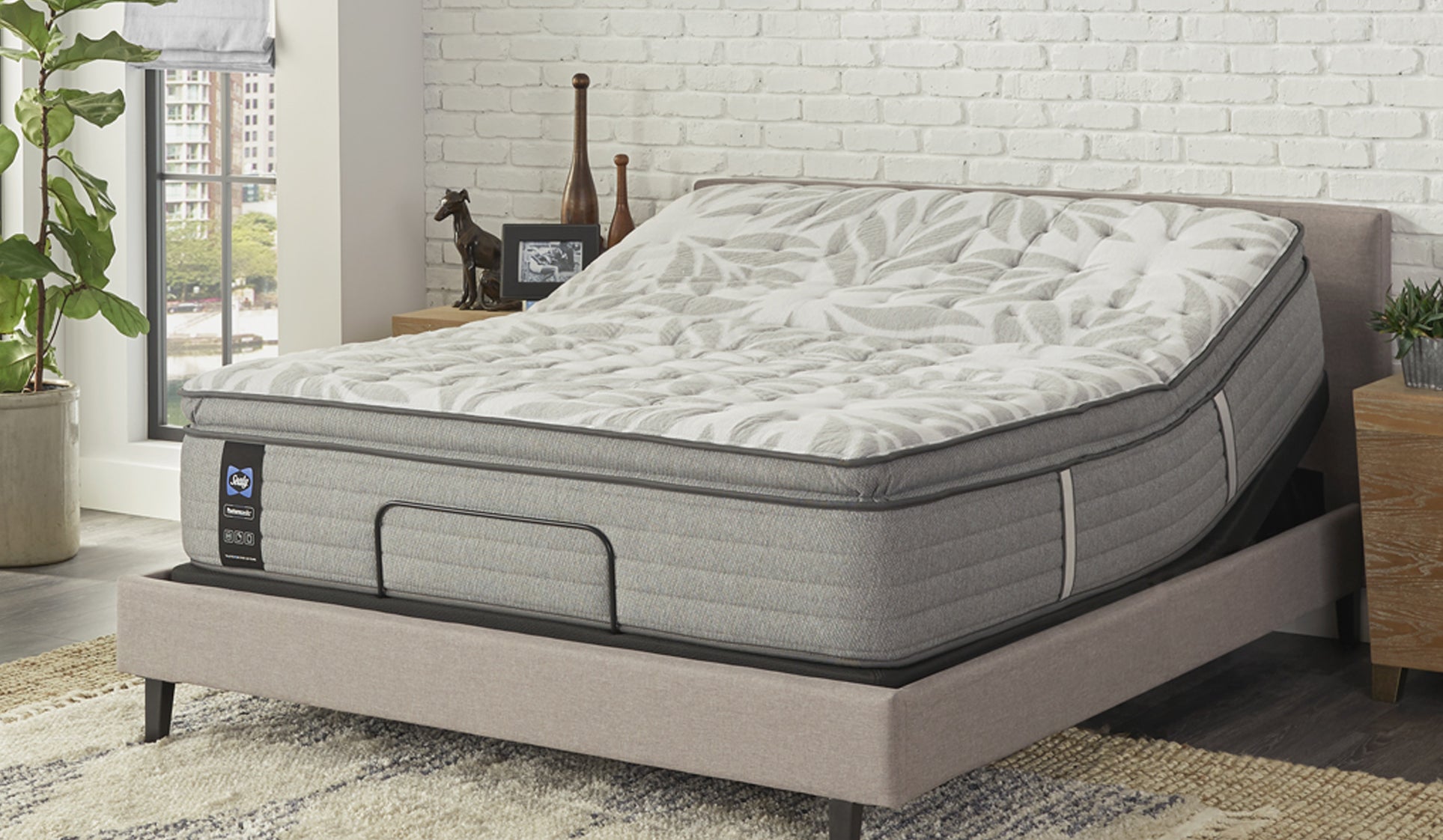 Dog and child lying on a Sealy&reg; mattress